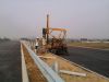 Highway guardrail pile driver
