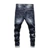 Mans fashionable ripped denim pants with patch
