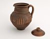 Ceramic jar with lid made of red clay. 