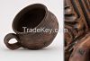 Ceramic tea cup, hand formed and made out of red clay. 