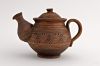 Ceramic tea pot made of red clay.