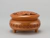 Round wooden jewelry box with hand carved pattern and metal inlay