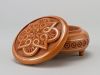 Round wooden jewelry box with hand carved pattern and metal inlay
