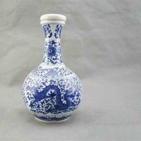 Embossed Dragon And Plum Flower Blue And White Wine Bottle