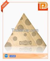 triangular cheese chopping board with pattern on surface