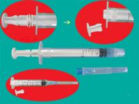 Disposable auto-disable syringe with needle