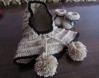 set of baby hat along with the neck warmer and booties