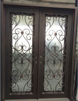 wrought iron door with operable glass