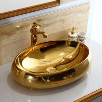 Oval gold colorful art above counter basin sinks bathroom