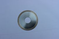 Metal bond diamond saw blade for sapphire cutting and grooving.