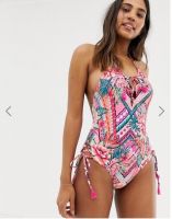 Accesorize swimsuit in bright floral print