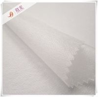 Nonwoven fusible interlining