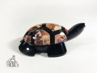 Obsidian turtle with opal inlaid