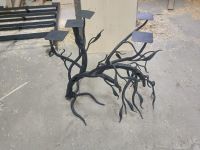 Tables made of wood and resin with forged underframes