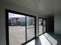 Customized 40ft High Cube Office shipping featuring sliding glass doors & window, insulated, AC unit and restroom