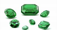 Loose emerald stones in various cuts and sizes