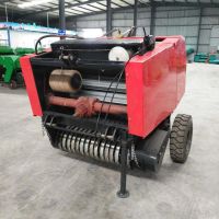 farmer use tractor mounted mini round hay baler grass corn wheat alfalfa hay picking baling machine