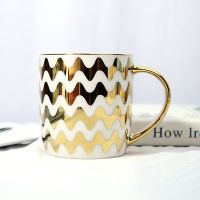 Gold Handle Coffee Mug With Geometric Design