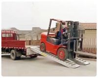 DXP aluminum ramps for loading forklift pickup