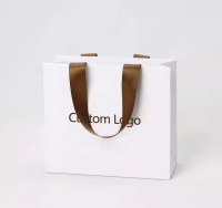 Wholesale Portable Paper Bags Customized Exclusive Logo Luxury Matte Gold Shopping Paper Bags