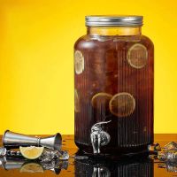 Glass beverage dispenser with tap