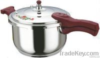 stainless steel pressure cooker with flower on lid