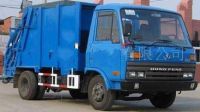 Compressing garbage truck