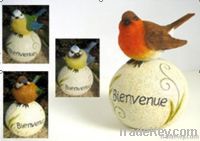 resin bird on ball decoration