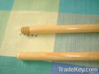 Varnished wooden broom handle