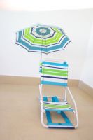 A Beach chair with an Umbrella