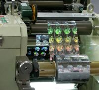 Narrow web hologram embossing machine