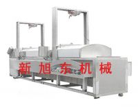 Continuous frying machines