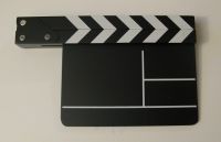 Wooden clapperboard with black & white clapper sticks