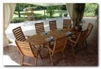 EXTENSIONAL OVAL TABLE IN IROKO WOOD