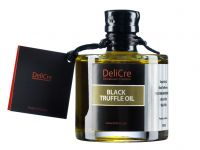 Black truffle aroma olive oil with a slice of dried black truffle inside