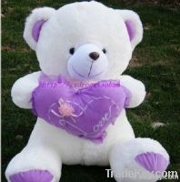 beautiful teddy plush toy with purple heart