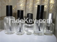 pretty nail polish bottle , plastic cap with brush , small glasss bottle