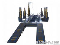 Powerful truck chassis straightening bench