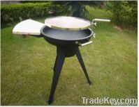 outdoor BBQ grill with wood table