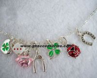 Baby bracelets with charms pig, ladybug, horseshoe, dice, four-leaf