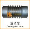 Corrugated tube for paver road construction machinery equipment