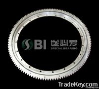 Single row four point contact ball bearing, with external gear & flange