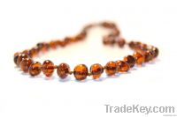 Baby teething necklace from natural Baltic amber.