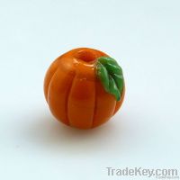 Handmade orange pumpkins with green leaf lampwork bead