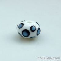 lampwork glass white bead with aqua dot