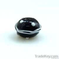 lampwork glass black bead with white dots and white swirl