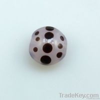 lampwork glass pink bead with black dots