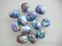 Lampwork glass beads with baking varnish