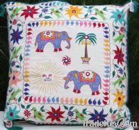 cushion covers, bed covers, wall hangings, table lamps, ladies sandles