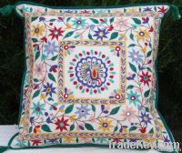 cushion covers, bed covers, wall hangings, table lamps, ladies sandles